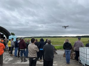 Members watching a drone demo