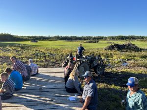 Members tour land conversion on a wagon